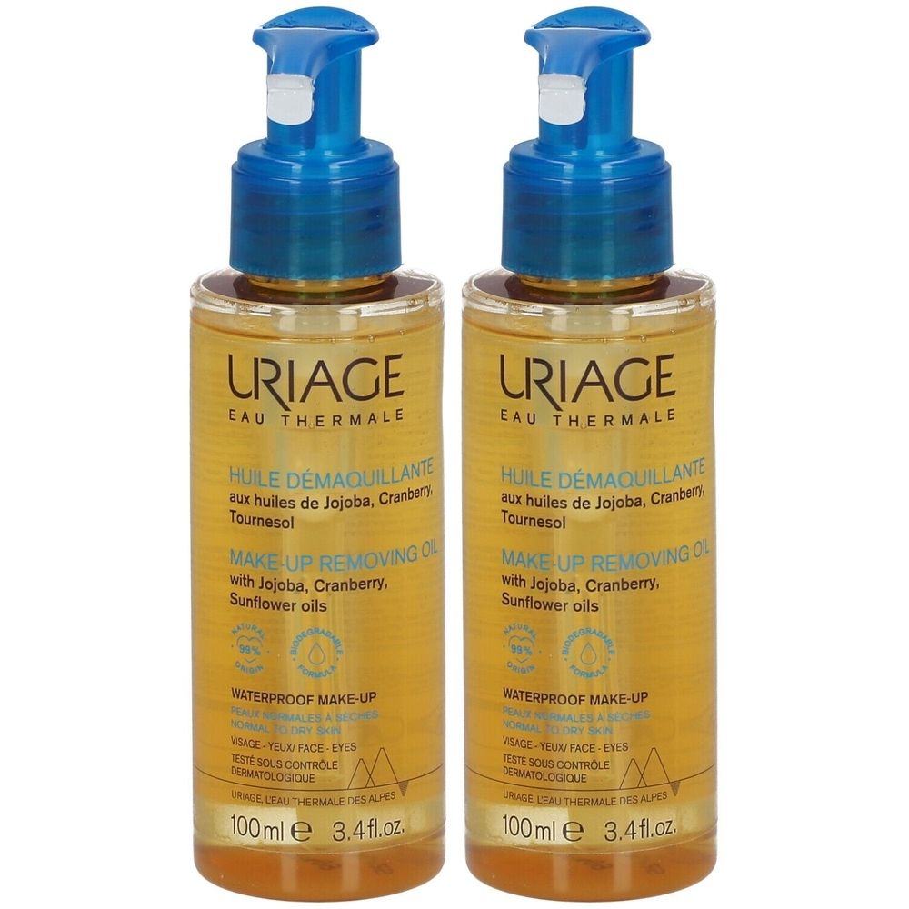 Zwei Flaschen URIAGE HUILE DÉMAQUILLANTE. Transparente Flüssigkeit, blaue Pumpaufsätze. Aufschrift: MAKE-UP REMOVING OIL.