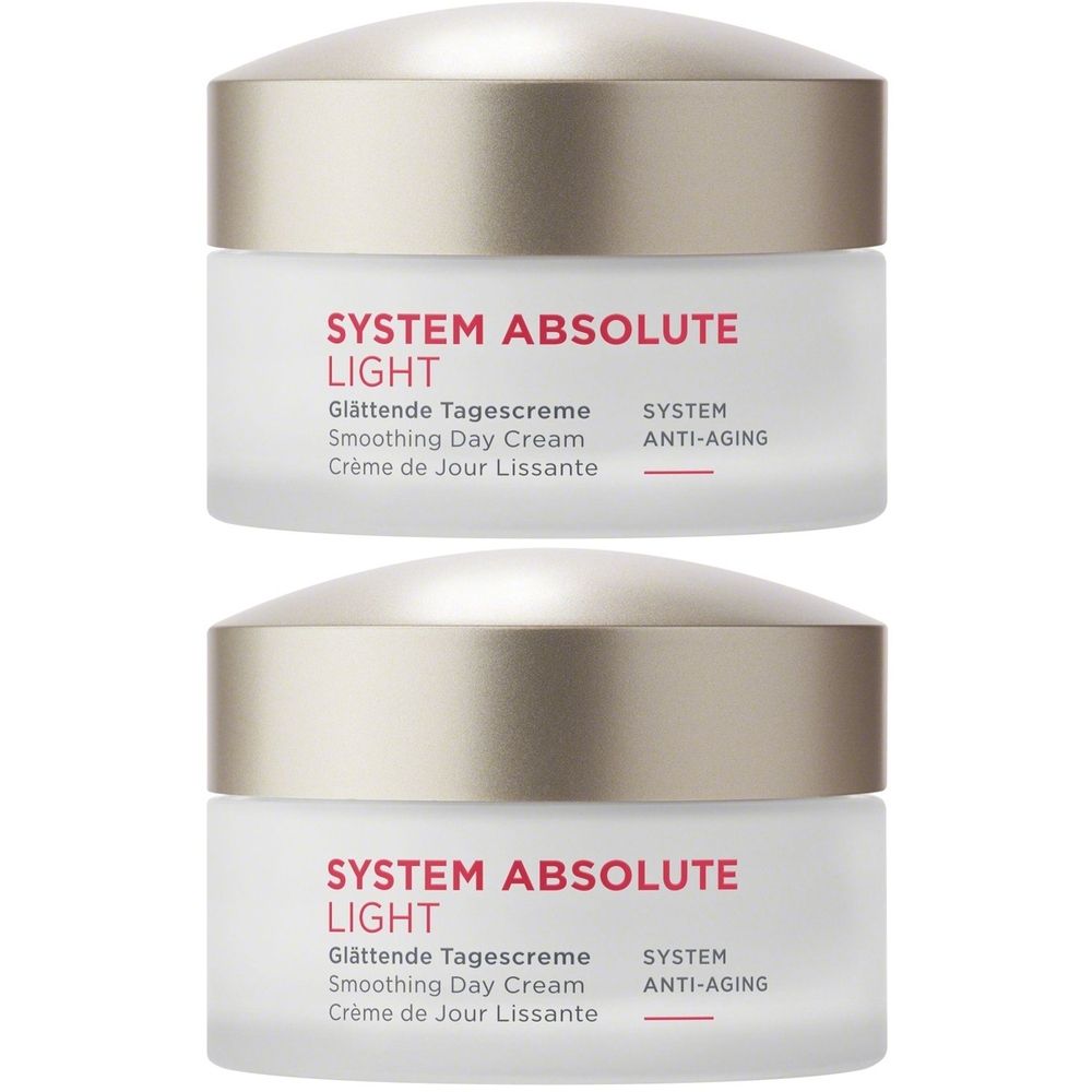Zwei Tiegel mit Deckel. Aufschrift: SYSTEM ABSOLUTE LIGHT, Glättende Tagescreme, Smoothing Day Cream, Crème de Jour Lissante, SYSTEM ANTI-AGING.