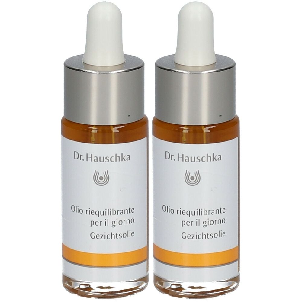 Deux flacons d'huile. Marque Dr. Hauschka. Étiquette avec nom du produit en italien et néerlandais.