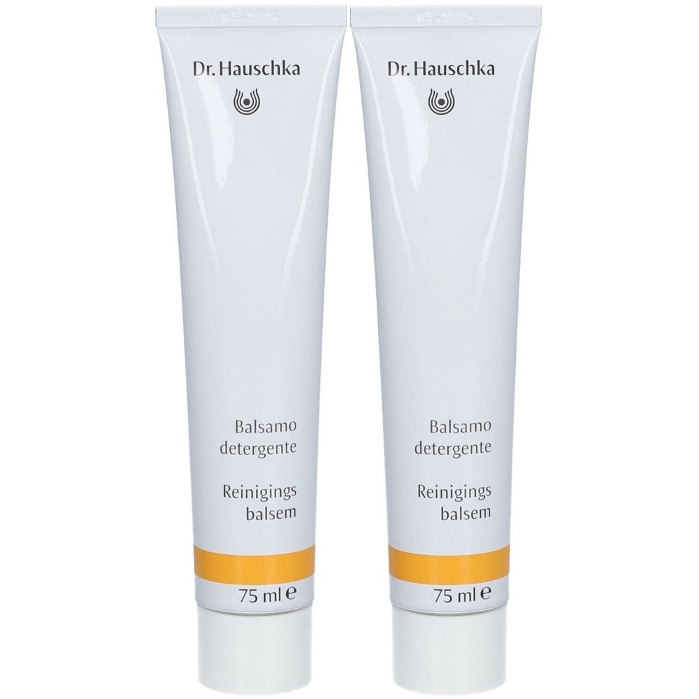 Deux tubes blancs avec bande jaune. Inscription: Dr. Hauschka, Balsamo detergente, Reinigings balsem. 75 ml.