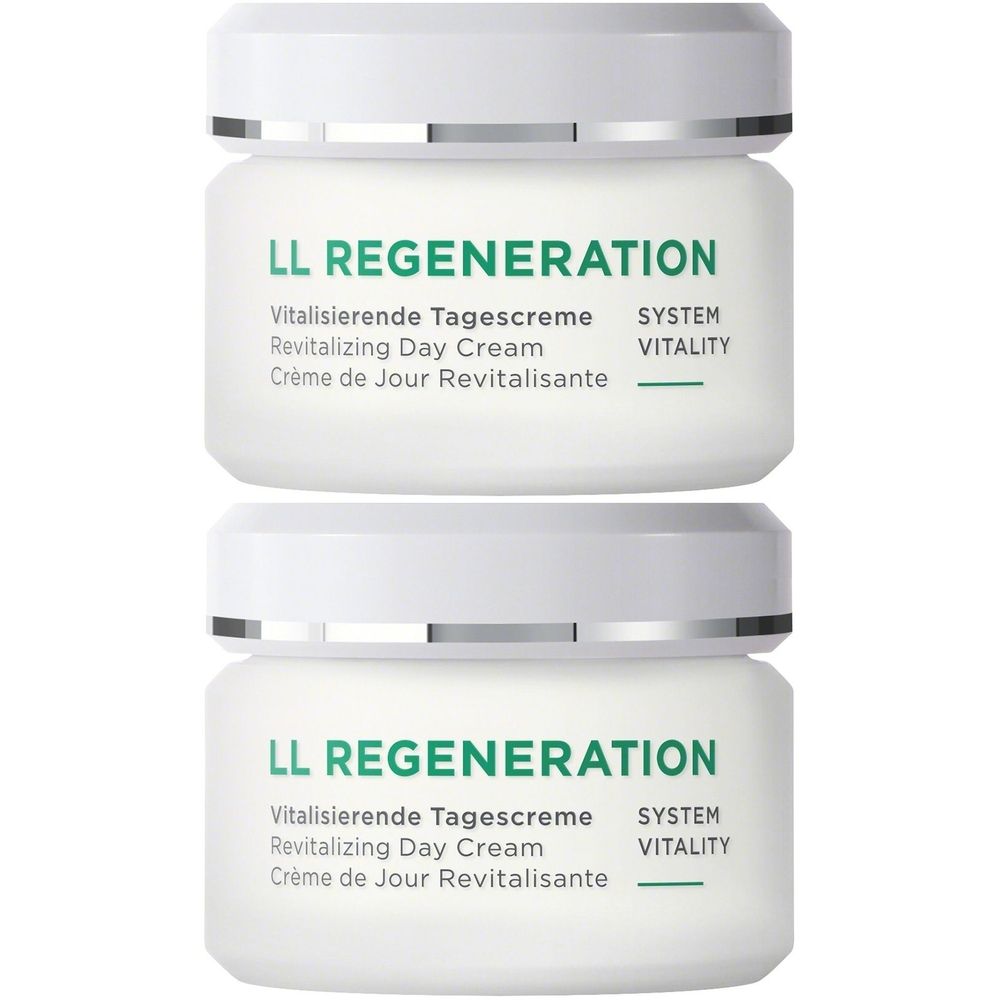 Zwei weiße Tiegel mit silbernen Deckeln. Aufschrift: LL REGENERATION, Vitalisierende Tagescreme, Revitalizing Day Cream, Crème de Jour Revitalisante.