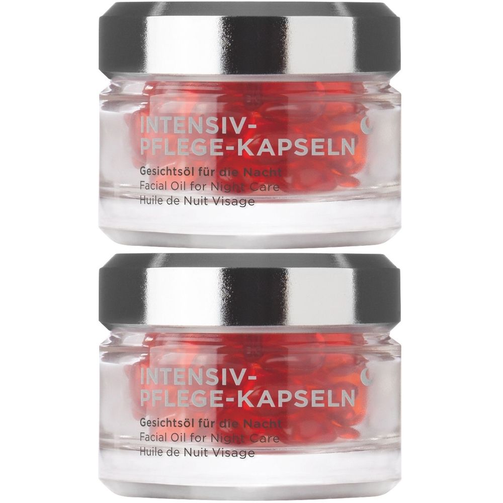 Deux pots de capsules rouges. Inscription: INTENSIV-PFLEGE-KAPSELN, Gesichtsöl für die Nacht, Facial Oil for Night Care, Huile de Nuit Visage.