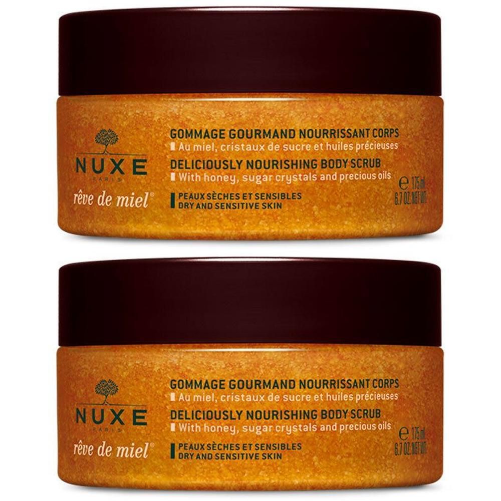 Deux pots de gommage corporel NUXE Rêve de Miel®. Couvercles bruns, contenu doré. Inscription : Gommage Gourmand Nourrissant Corps.