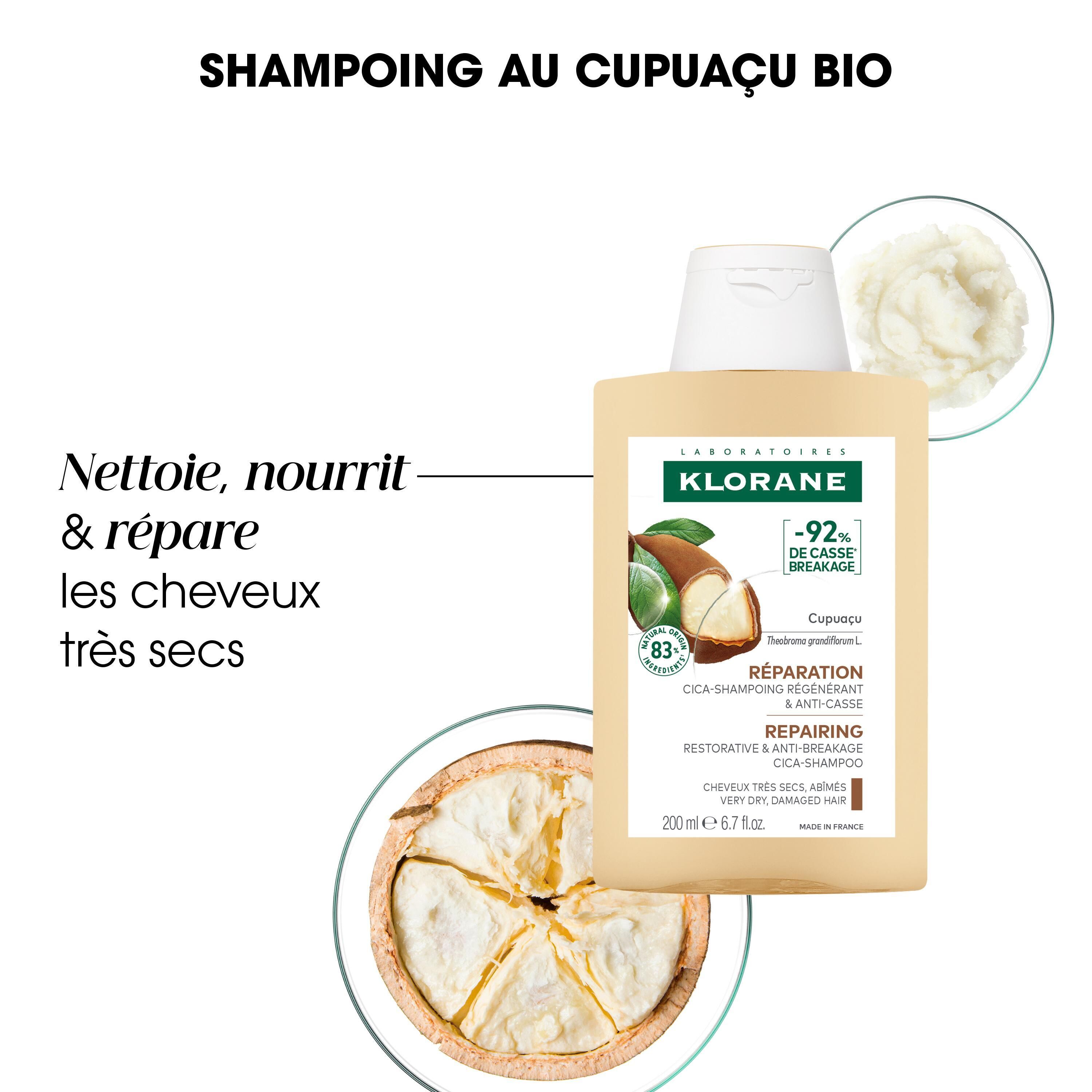 Flacon de shampooing beige à bouchon blanc. Texte : Klorane, Cupuaçu, réparation, anti-casse. Texte additionnel : Nettoie, nourrit & répare les cheveux très secs.