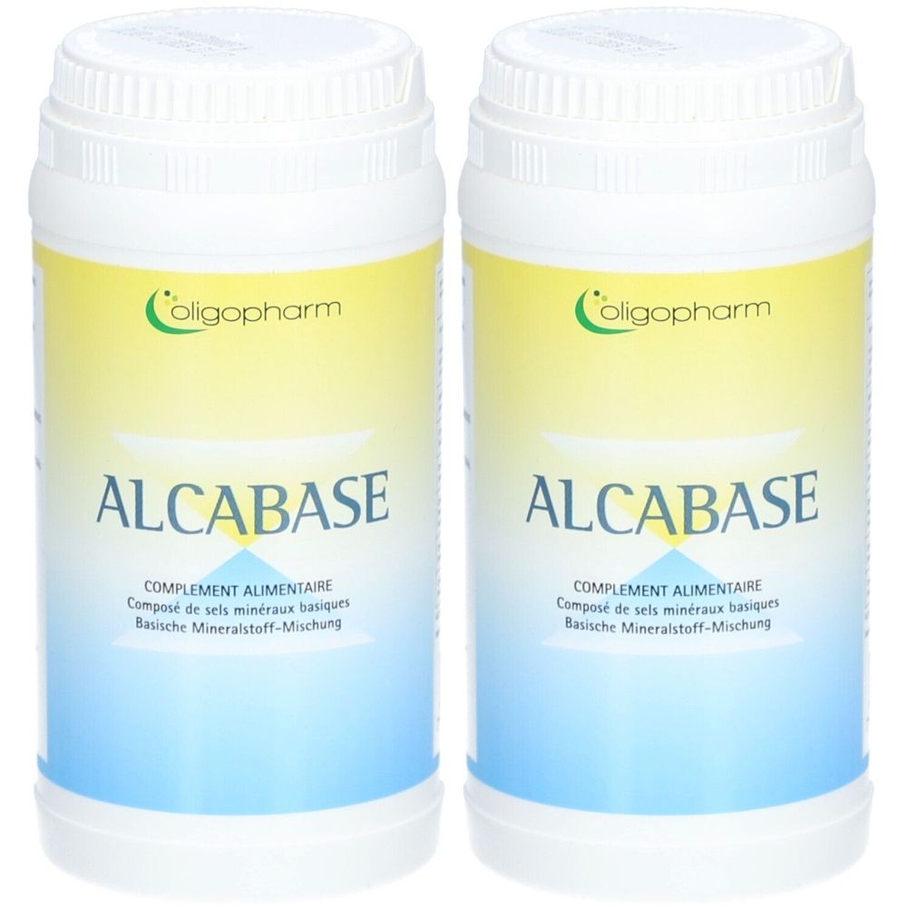 Deux boîtes blanches avec étiquette jaune et bleue. Inscription : ALCABASE, complément alimentaire. Marque : Oligopharm.