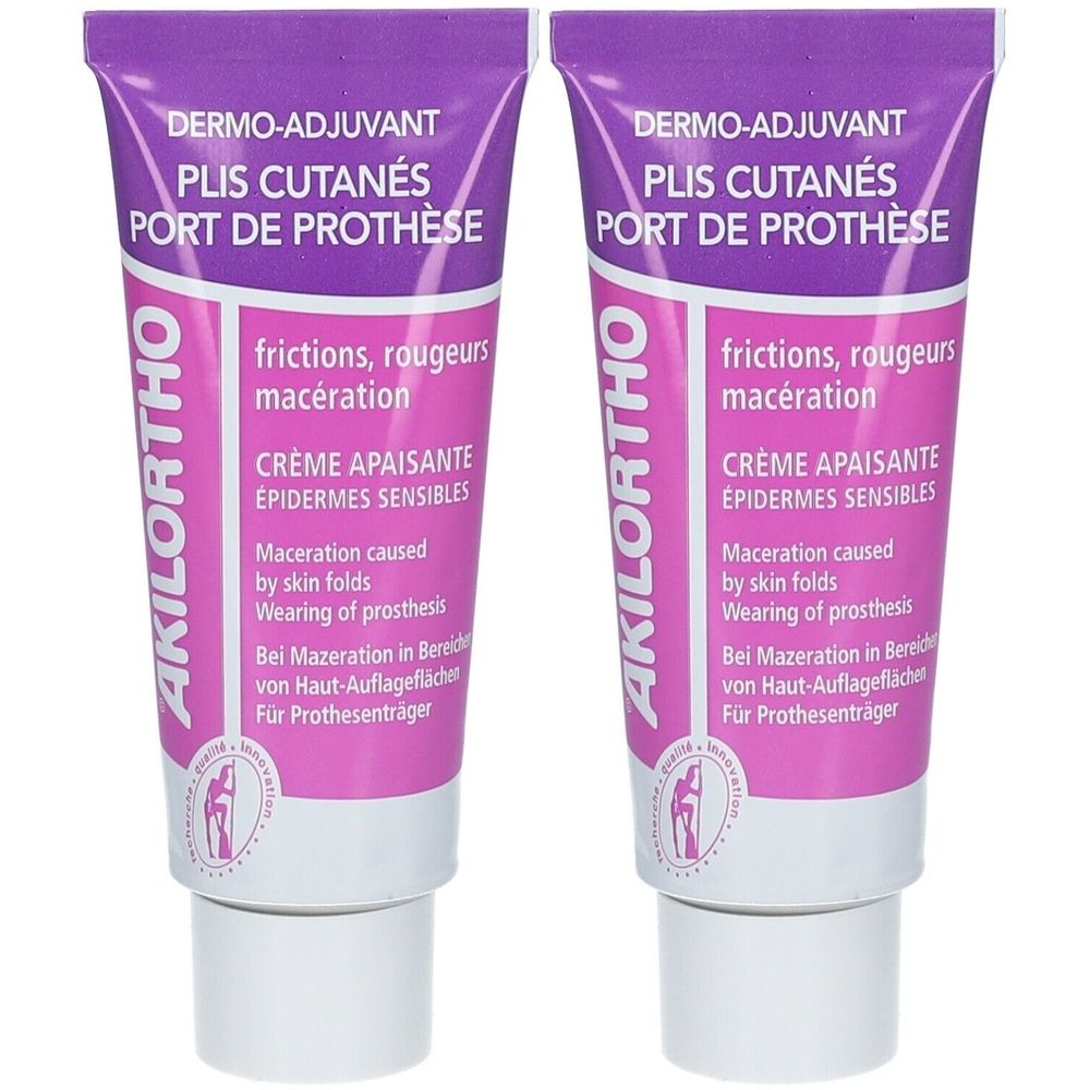 Deux tubes de crème Akilortho. Emballage violet et blanc avec informations et logo. Texte : Dermo-Adjuvant, Crème Apaisante.