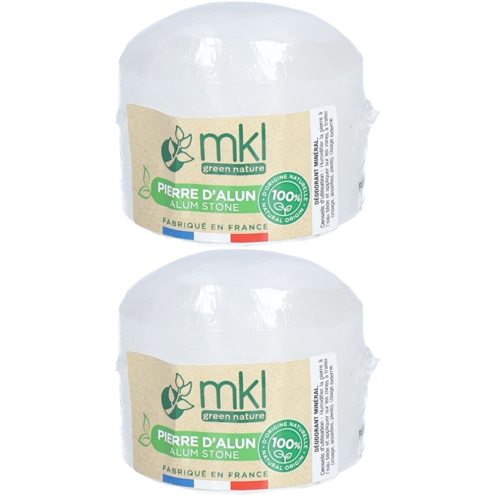 Deux pierres rondes et transparentes, emballées. Étiquettes avec "mkl green nature", "Pierre d'alun", "100% naturel".