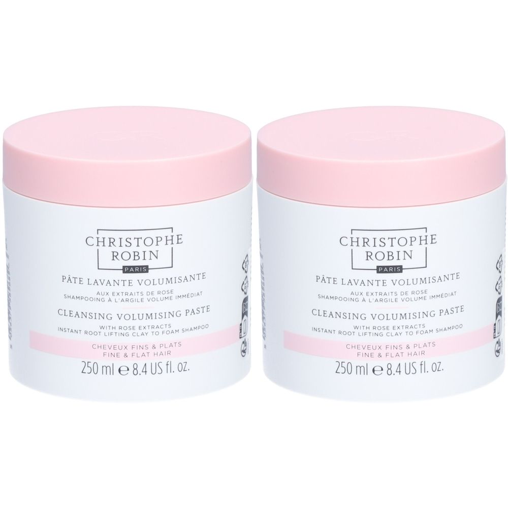 Deux pots blancs avec couvercles roses. Inscription : CHRISTOPHE ROBIN, PÂTE LAVANTE VOLUMISANTE, CLEANSING VOLUMISING PASTE.