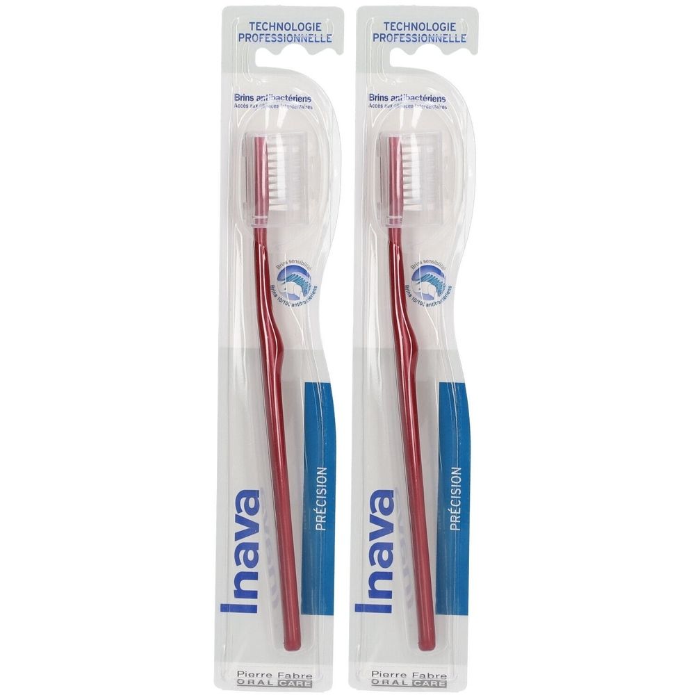 Zwei rote Zahnbürsten in Verpackung. Marke Inava, mit der Aufschrift "PRÉCISION".
