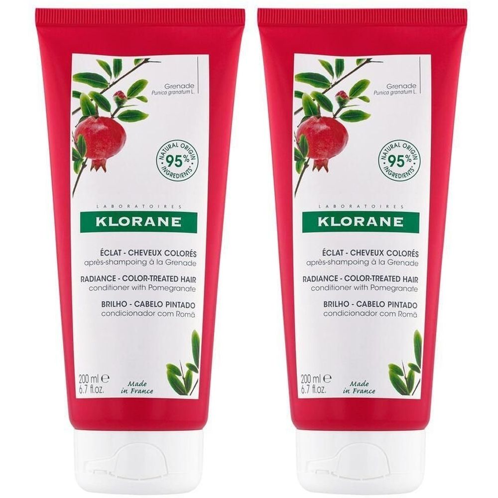 Deux tubes rouges avec bouchon blanc. Sur chaque tube: KLORANE, nom du produit, illustration de grenade, 95% ingrédients d'origine naturelle.