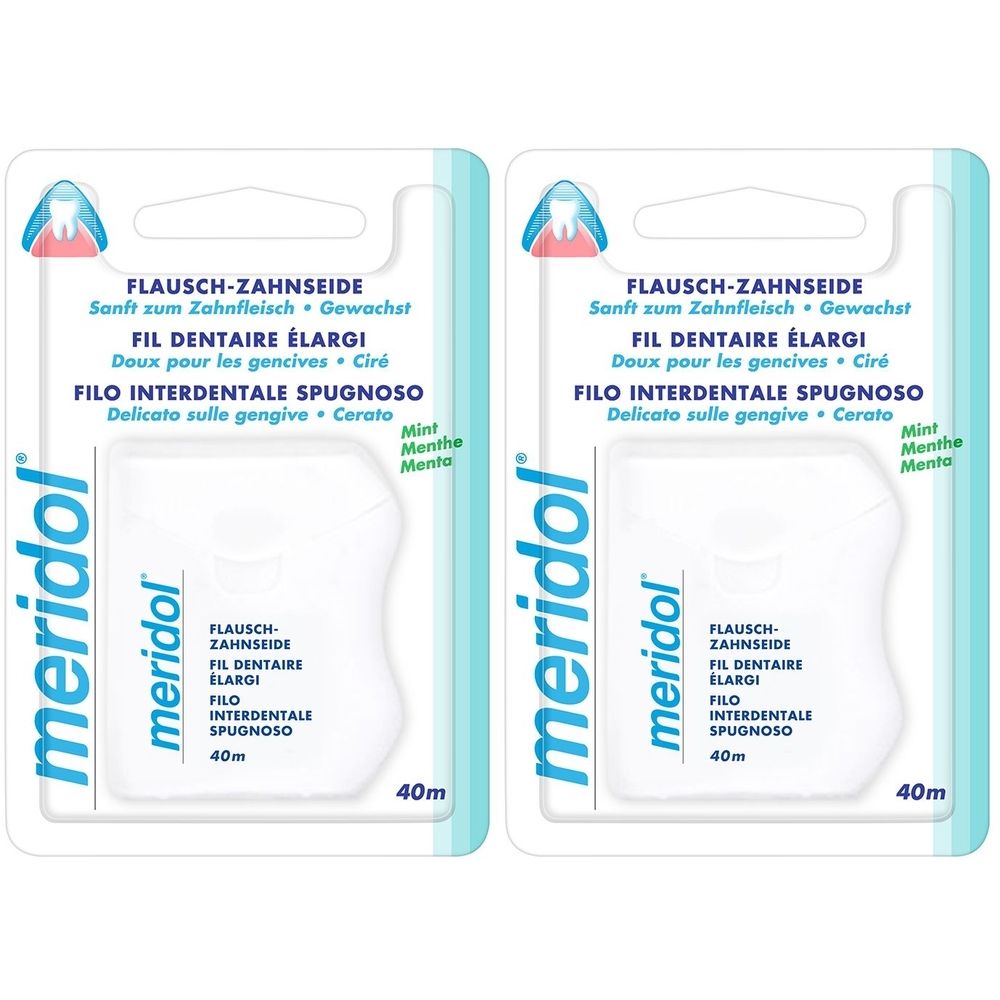 Zwei Packungen Meridol-Zahnseide. Weiße Kunststoffbehälter mit blauer Verpackung. Text: FLAUSCH-ZAHNSEIDE, FIL DENTAIRE ÉLARGI, FILO INTERDENTALE SPUGNOSO.