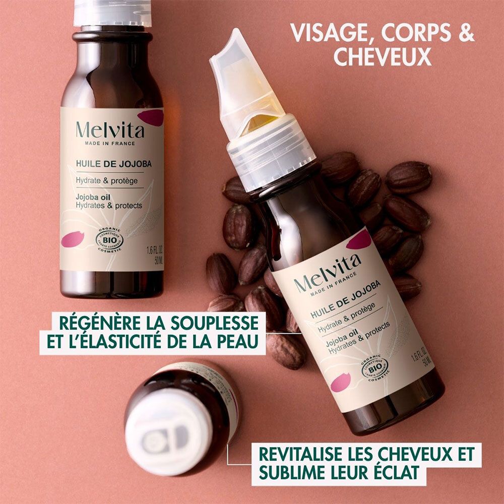 Plusieurs flacons Melvita Huile de Jojoba. Texte : Visage, corps & cheveux. Régénère la souplesse et l'élasticité de la peau.