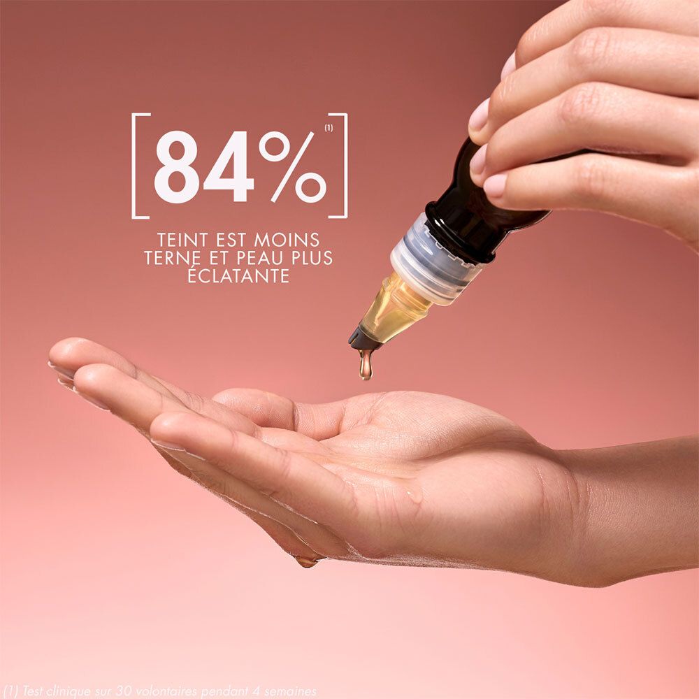 Hand mit Tropfen Melvita Bio-Aprikosenkernöl. Text: 84%. Teint est moins terne et peau plus éclatante.