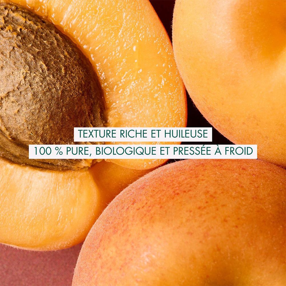 Aprikosenhälften. Text: Texture riche et huileuse. 100% pure, biologique et pressée à froid.