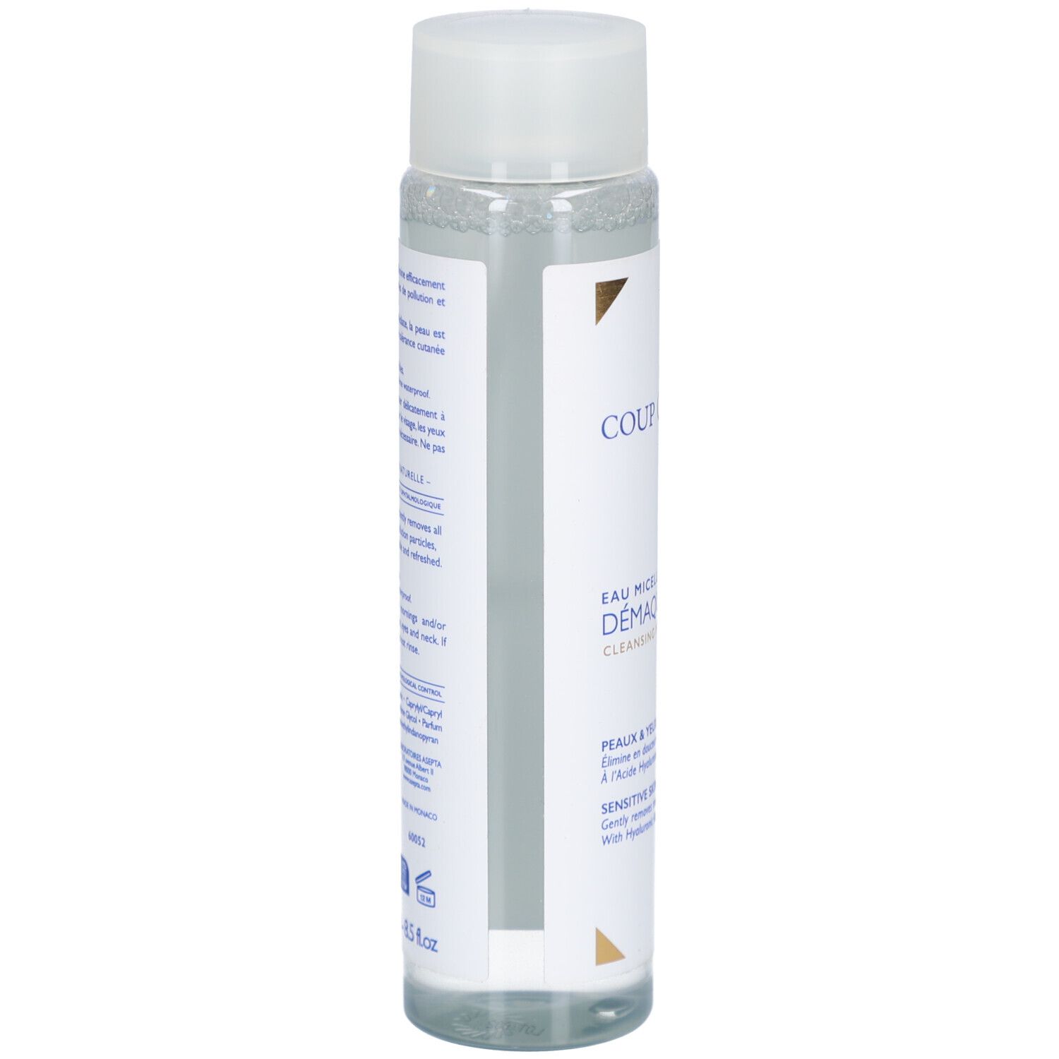 Rückseite der Flasche. Text in Französisch. Enthält Informationen über die Anwendung und Inhaltsstoffe. Mit Logo.