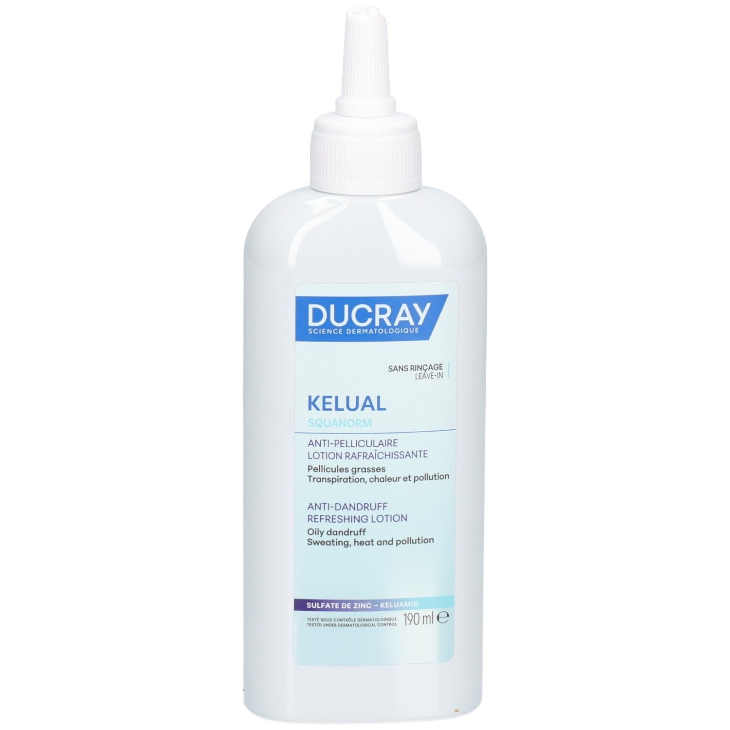 Weiße Flasche mit spitzem Applikator. Blaue Beschriftung: Ducray, Kelual, Anti-Schuppen Lotion. 190 ml.