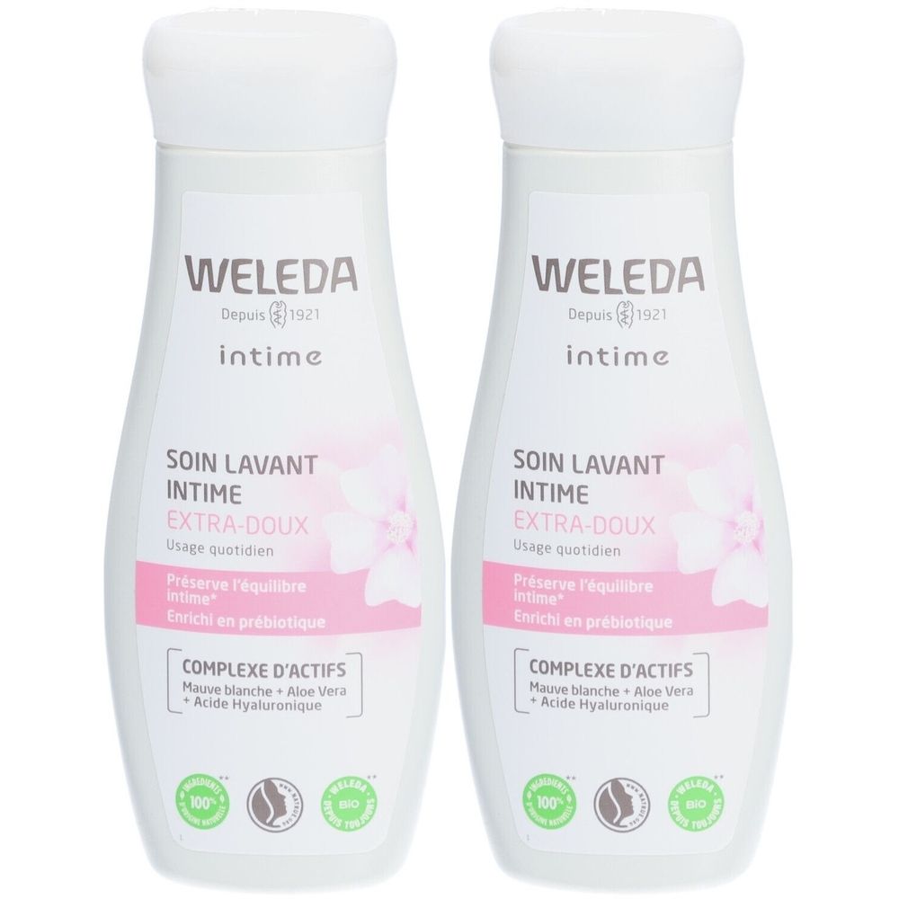Zwei weiße Flaschen mit rosa Etiketten. Aufschrift: WELEDA, intime, SOIN LAVANT INTIME EXTRA-DOUX. Mit grünen Siegeln.