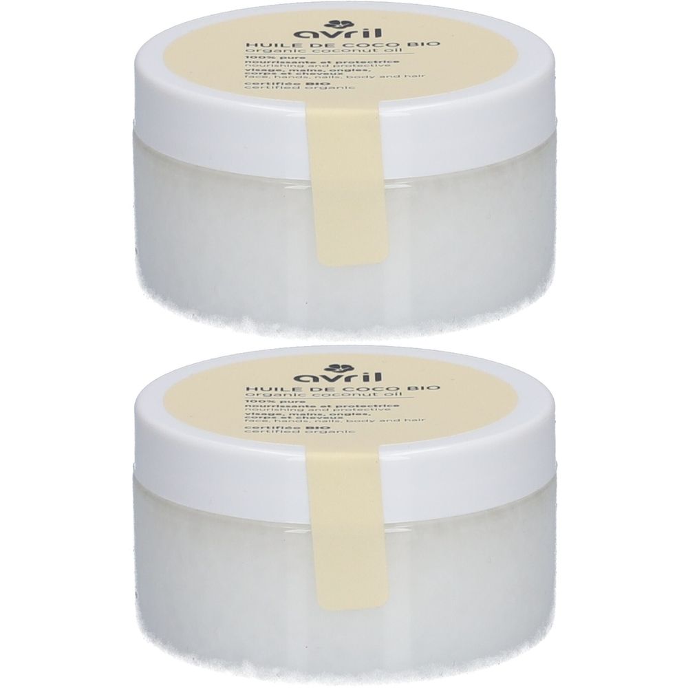 Zwei runde, weiße Tiegel mit Deckel und Etikett. Auf dem Etikett steht "Huile de Coco Bio" und der Markenname "Avril".