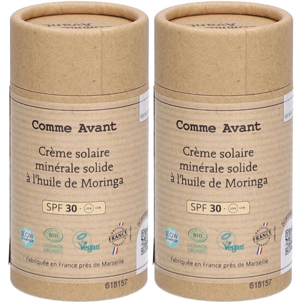 Zwei zylindrische Behälter aus braunem Papier. Aufschrift: Comme Avant Crème solaire minérale solide SPF30. Mit Bio- und Vegan-Siegeln.