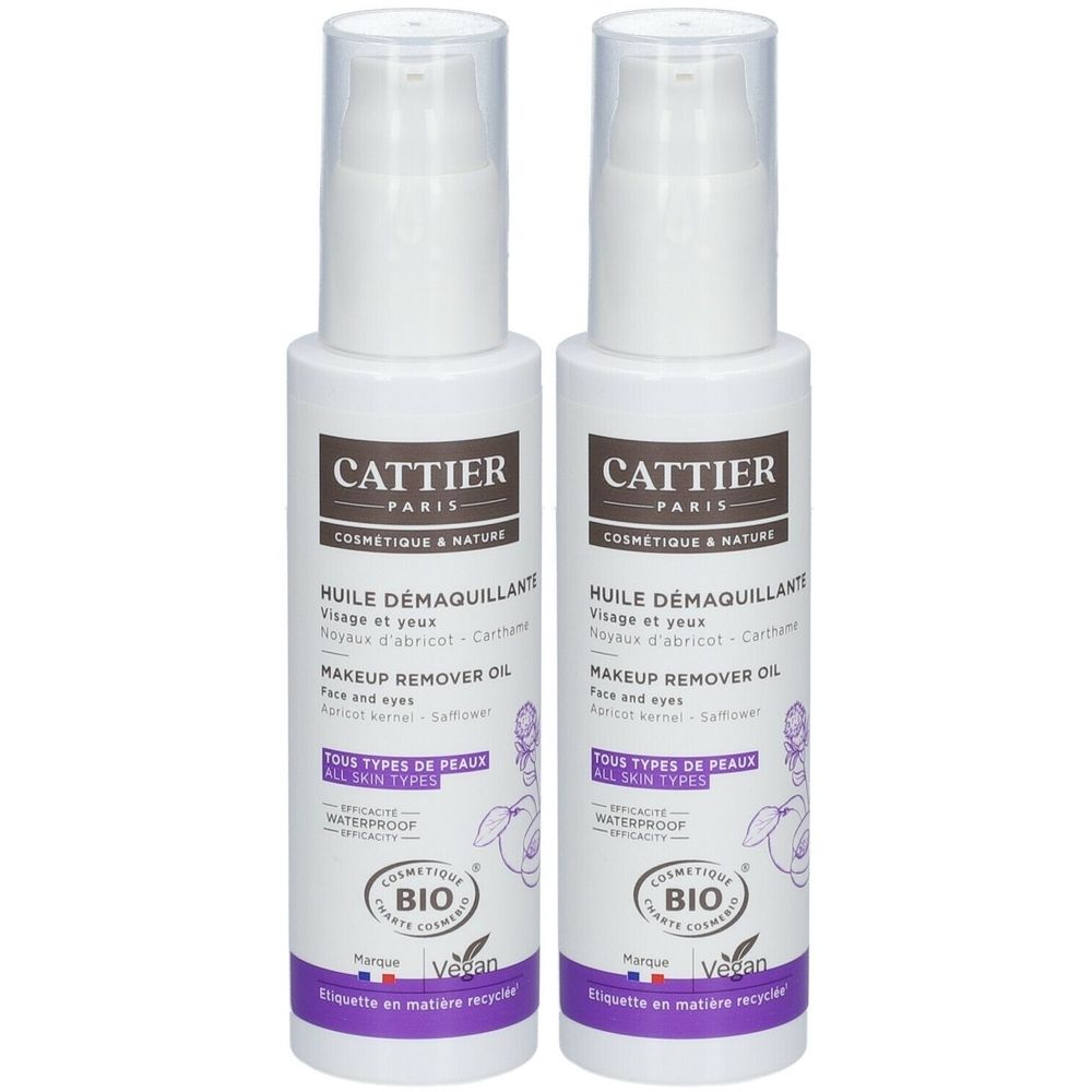 Deux flacons blancs avec pompe. Inscription: Cattier Paris, Huile Démaquillant, Makeup Remover Oil. Certification Bio et logo Vegan.