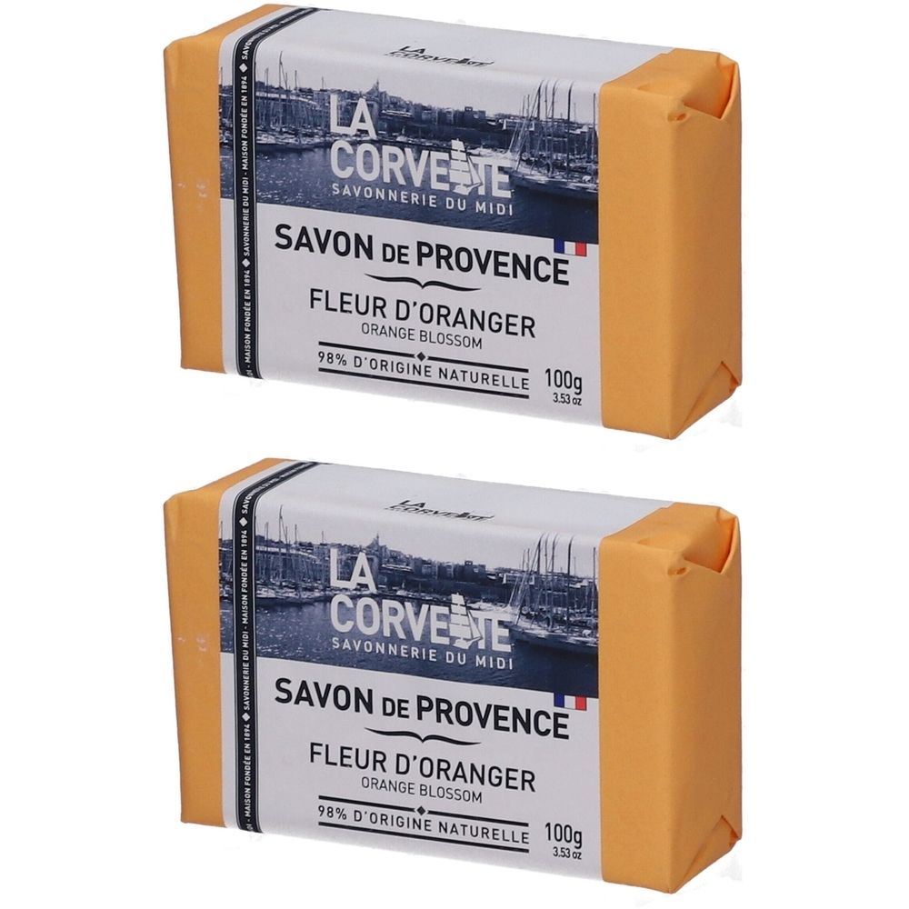 Deux savons rectangulaires emballés en orange. L'emballage porte l'inscription "SAVON DE PROVENCE FLEUR D'ORANGER".