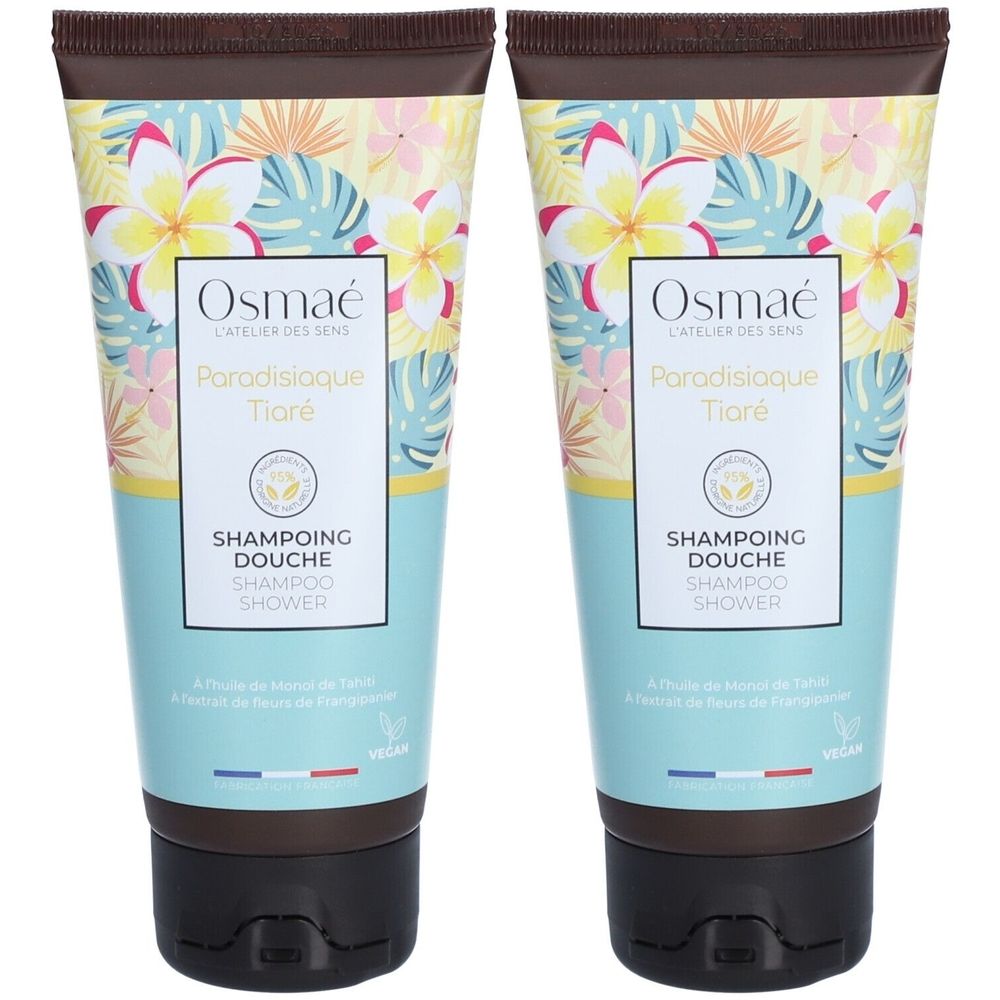 Deux tubes de Shampoing douche Paradisiaque Tiaré Osmaé. Turquoise, imprimé floral. Bouchon noir, couvercle marron. Logo végan.