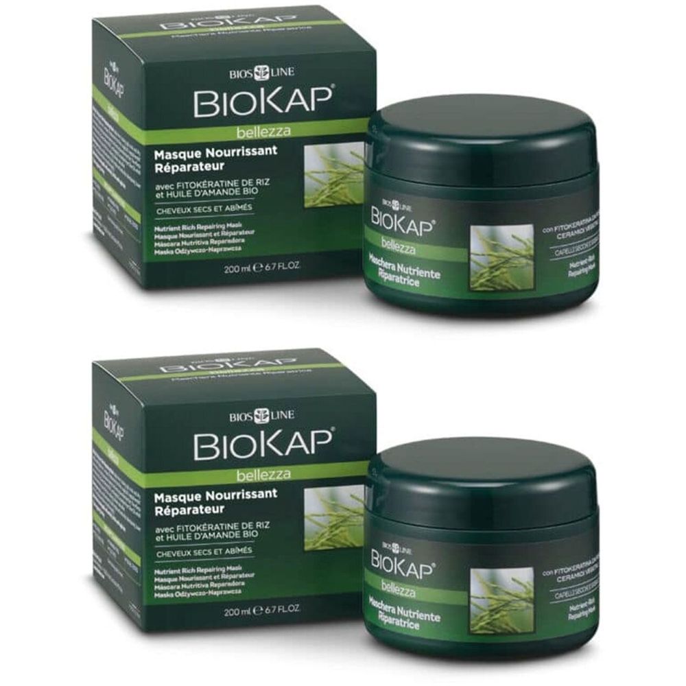 Deux pots et boîtes verts. Sur les boîtes, BIOKAP, Masque Nourrissant Réparateur. Sur les pots, BIOKAP, Maschera Nutriente Riparatrice.