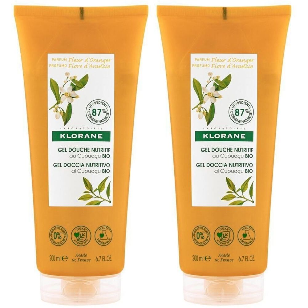 Zwei Tuben KLORANE Duschgel mit Orangenblüten. Gelbe Verpackung mit Produktinformationen und Logo. Enthält 87% natürliche Inhaltsstoffe.