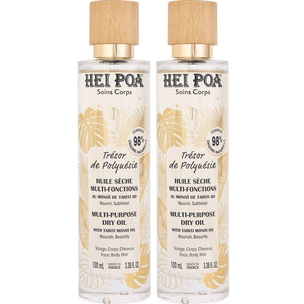 Deux flacons d'huile sèche. Inscription: HEI POA, Trésor de Polynésie, Multi-Purpose Dry Oil. Bouchons en bois, texte doré.