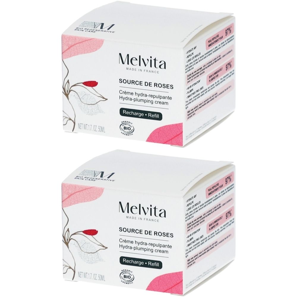 Deux recharges Melvita Source de Roses Crème Hydra-repulpante. Boîte blanche avec des fleurs et feuilles roses.