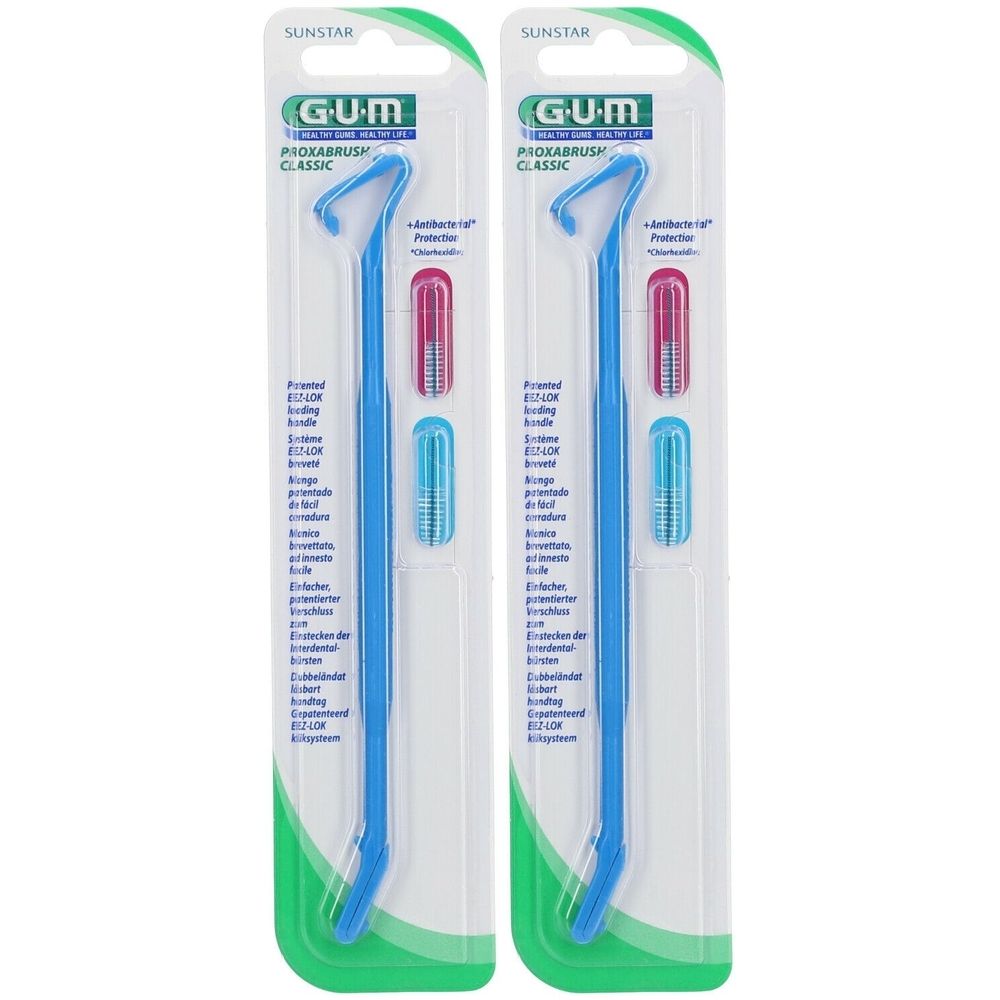Deux brossettes interdentaires emballées. Manches bleues, têtes rose et bleu. Marque GUM.