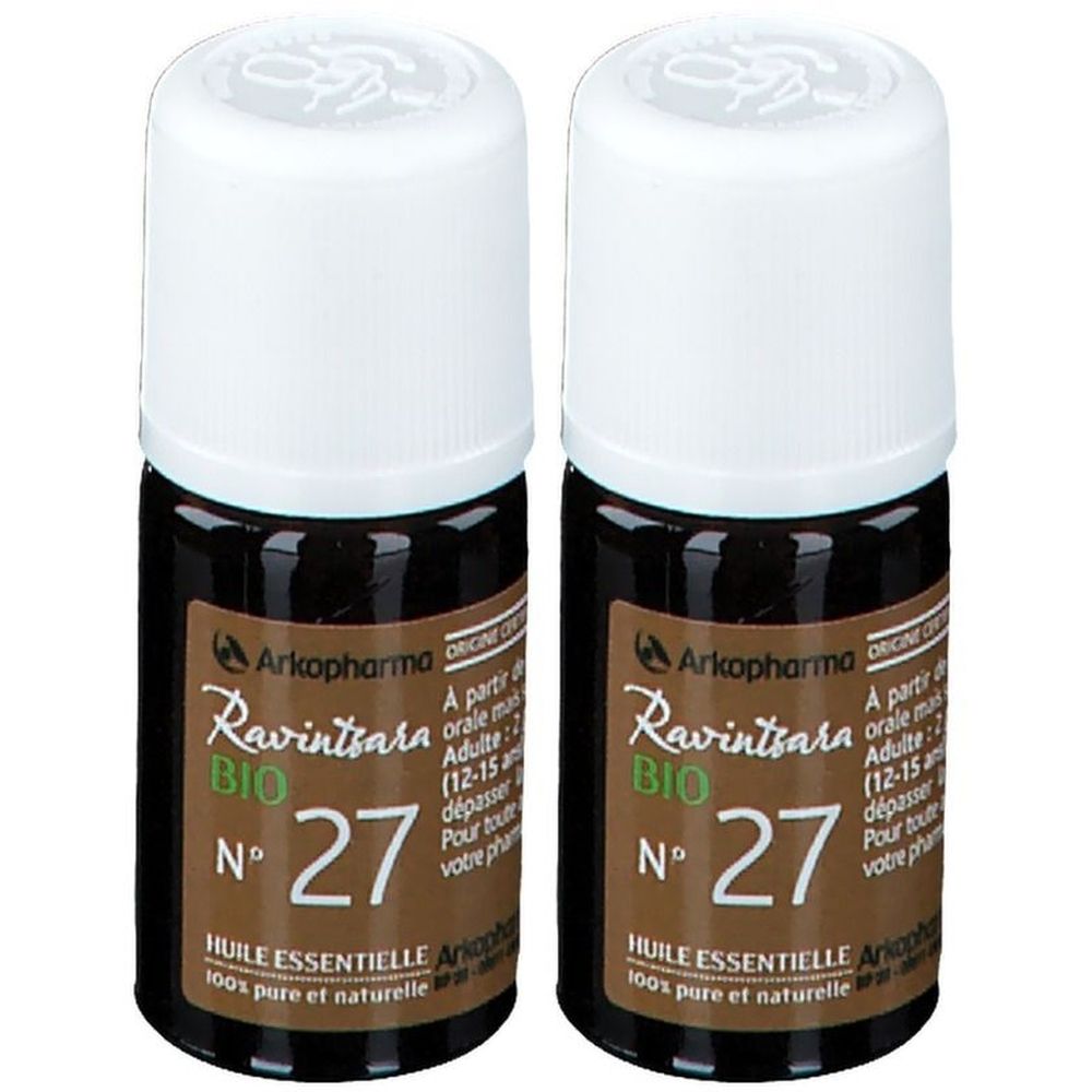 Deux flacons bruns avec bouchons blancs. Inscription: Arkopharma, Ravintsara BIO, N° 27, Huile essentielle.