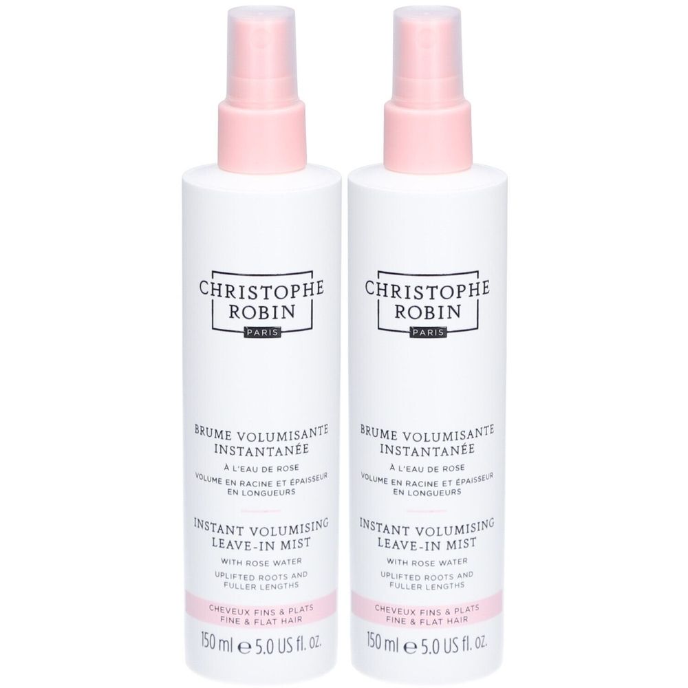Deux flacons vaporisateurs blancs avec bouchons roses. Inscription: CHRISTOPHE ROBIN PARIS. Texte: Brume Volumisant Instantanée, Instant Volumising Leave-in Mist.