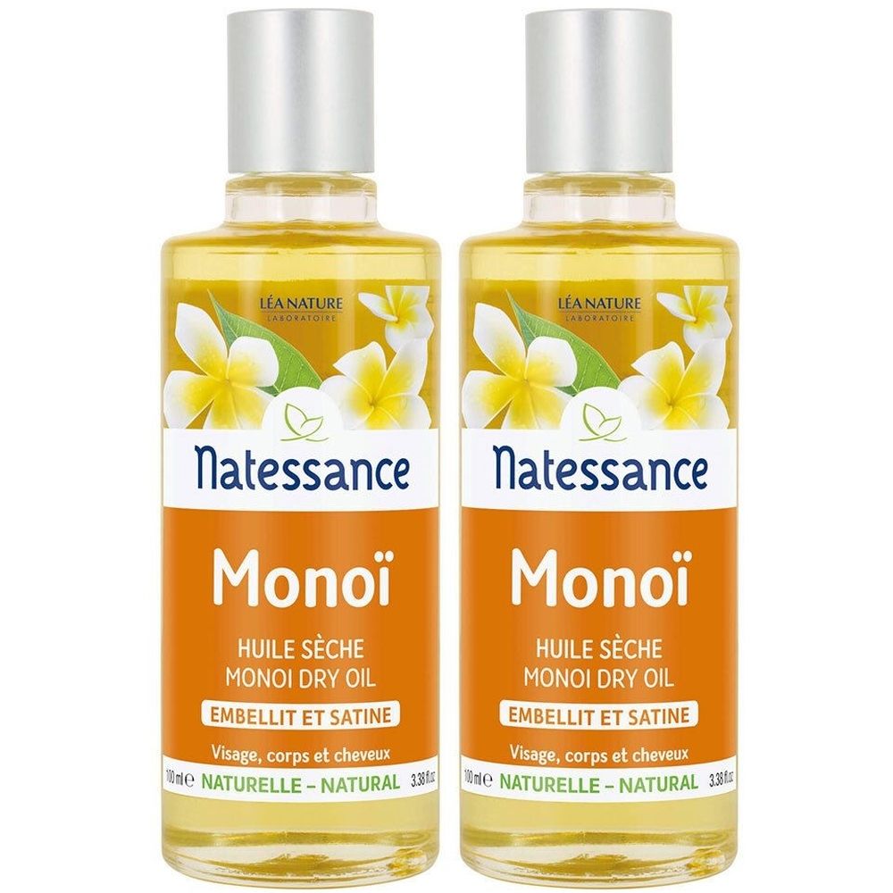 Zwei Flaschen mit gelber Flüssigkeit. Auf den Etiketten steht "Natessance Monoï Huile Sèche". Die Flaschen haben silberne Verschlüsse und Blüten-Dekoration.