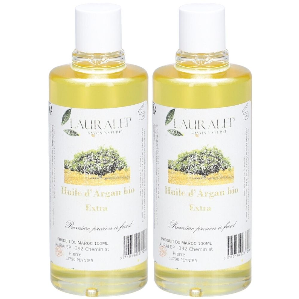 Zwei Flaschen mit gelbem Öl. Auf den Etiketten steht "Huile d'Argan bio Extra" und "LAURALEP". Weiße Deckel.