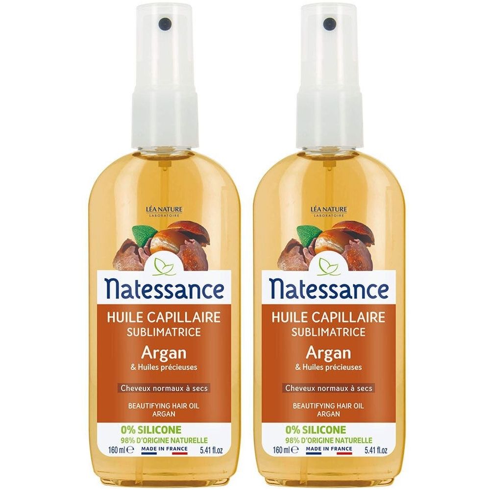 Zwei Sprühflaschen mit gelber Flüssigkeit. Aufschrift: Natessance Huile Capillaire Sublimatrice Argan. Etikett mit Text und Logo.