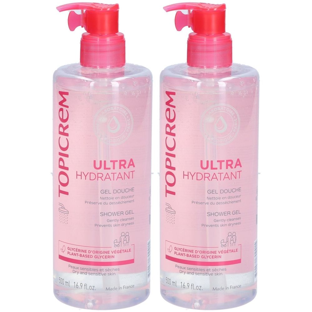 Zwei transparente Flaschen mit rosa Deckel. Aufschrift TOPICREM, ULTRA HYDRATANT, GEL DOUCHE, SHOWER GEL. Für trockene und empfindliche Haut.