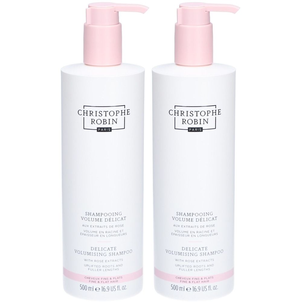 Zwei weiße Shampoo-Flaschen mit rosa Pumpaufsatz. Aufschrift: CHRISTOPHE ROBIN. Text: DELICATE VOLUMISING SHAMPOO. Volumen: 500 ml.