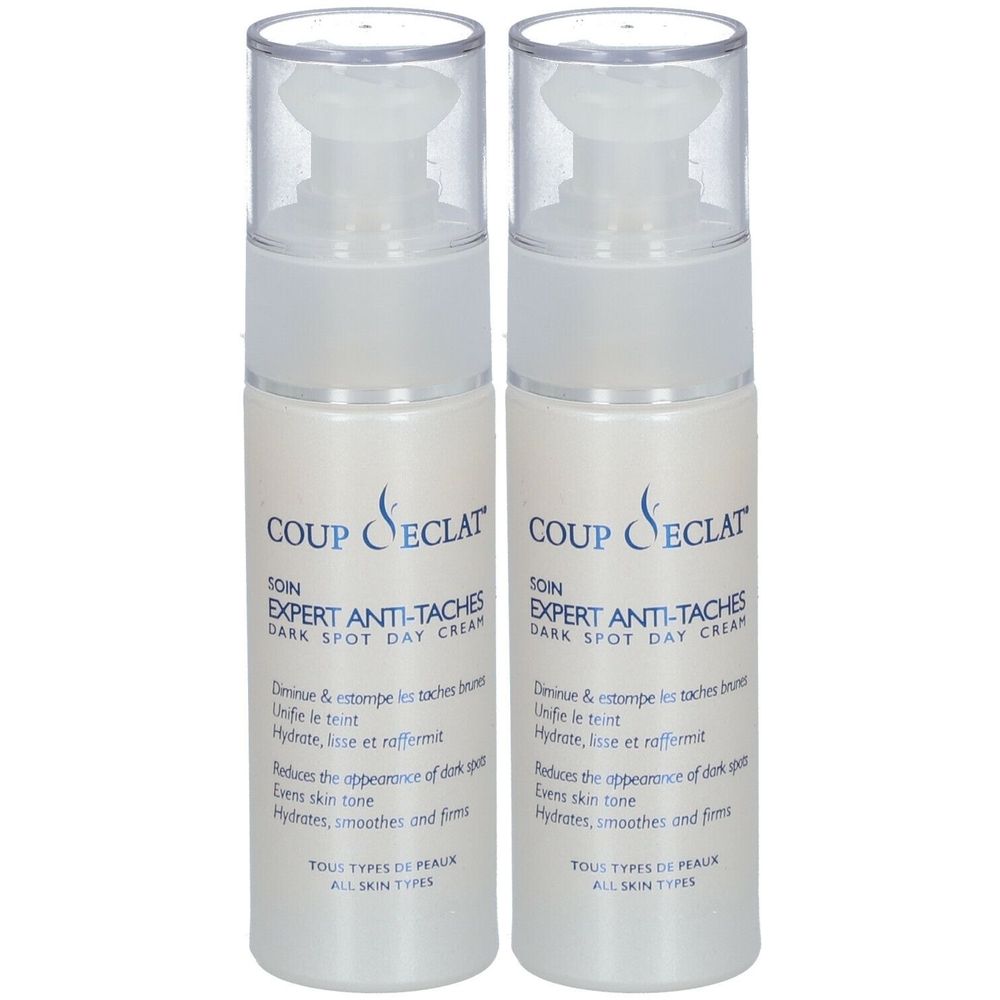 Zwei weiße Flaschen mit Pumpverschluss. Aufschrift: COUP D'ÉCLAT SOIN EXPERT ANTI-TACHES. Text in Französisch.