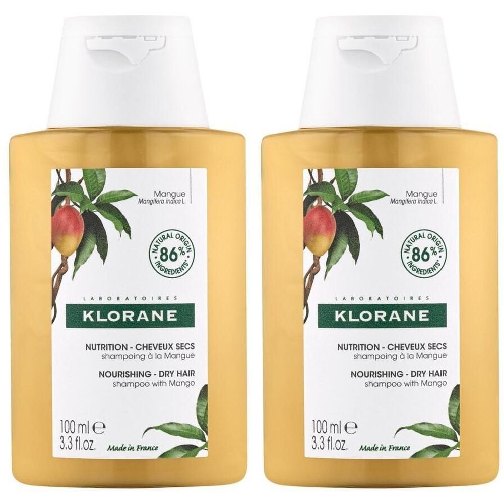 Deux flacons de shampooing KLORANE à la mangue. Flacons jaunes avec bouchon blanc. Étiquette avec illustration de mangue et texte. 86% ingrédients naturels.
