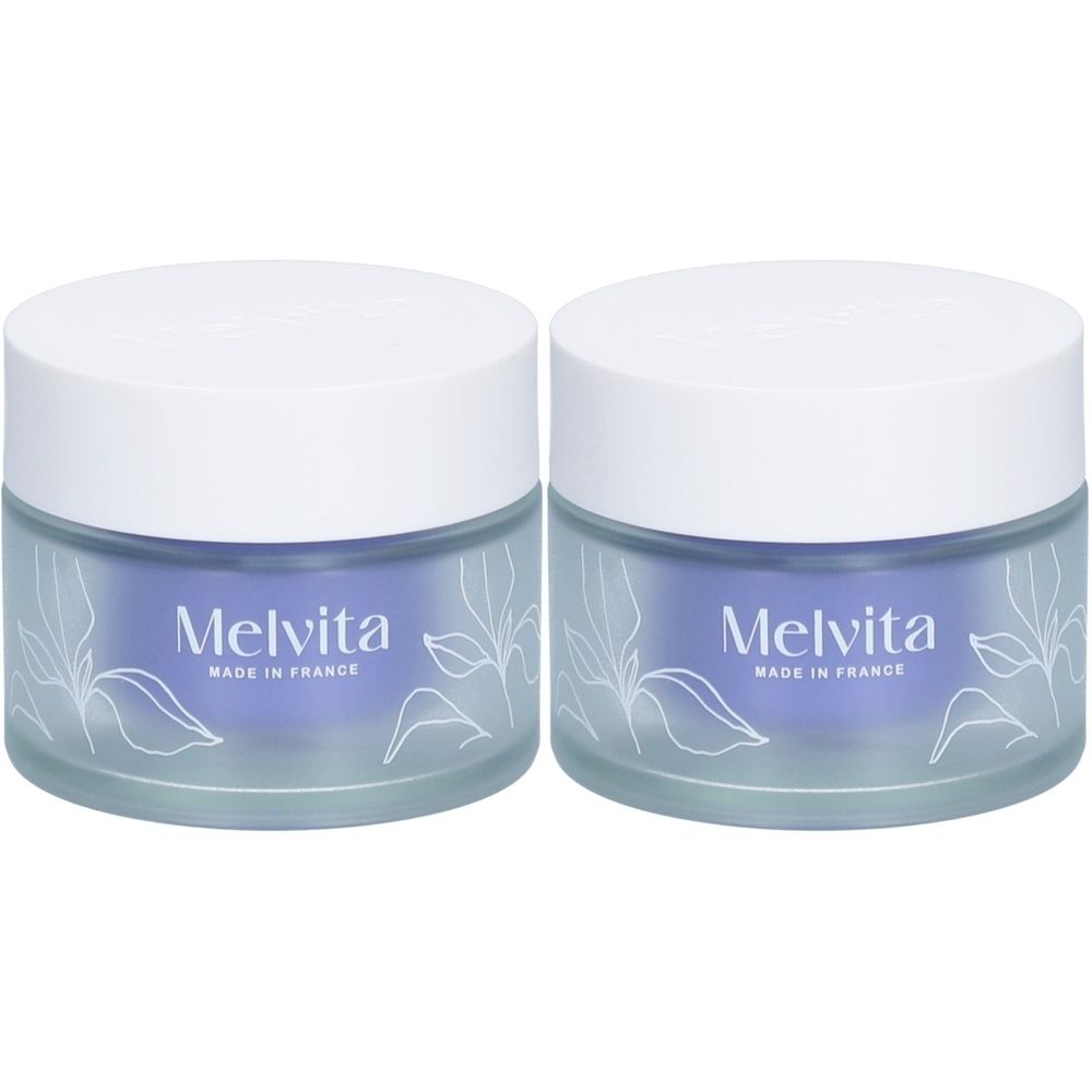 Zwei Tiegel mit weißem Deckel und blauem Glas. Auf der Vorderseite steht "Melvita, Made in France".