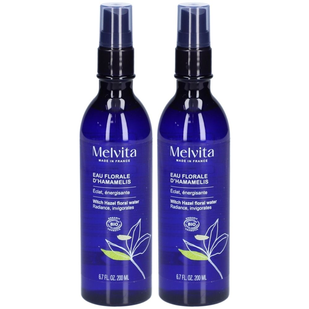 Deux flacons bleus avec vaporisateur. Inscription: Melvita Eau Florale D'Hamamélis. Certification Bio. 6.7 FL OZ 200 ML.