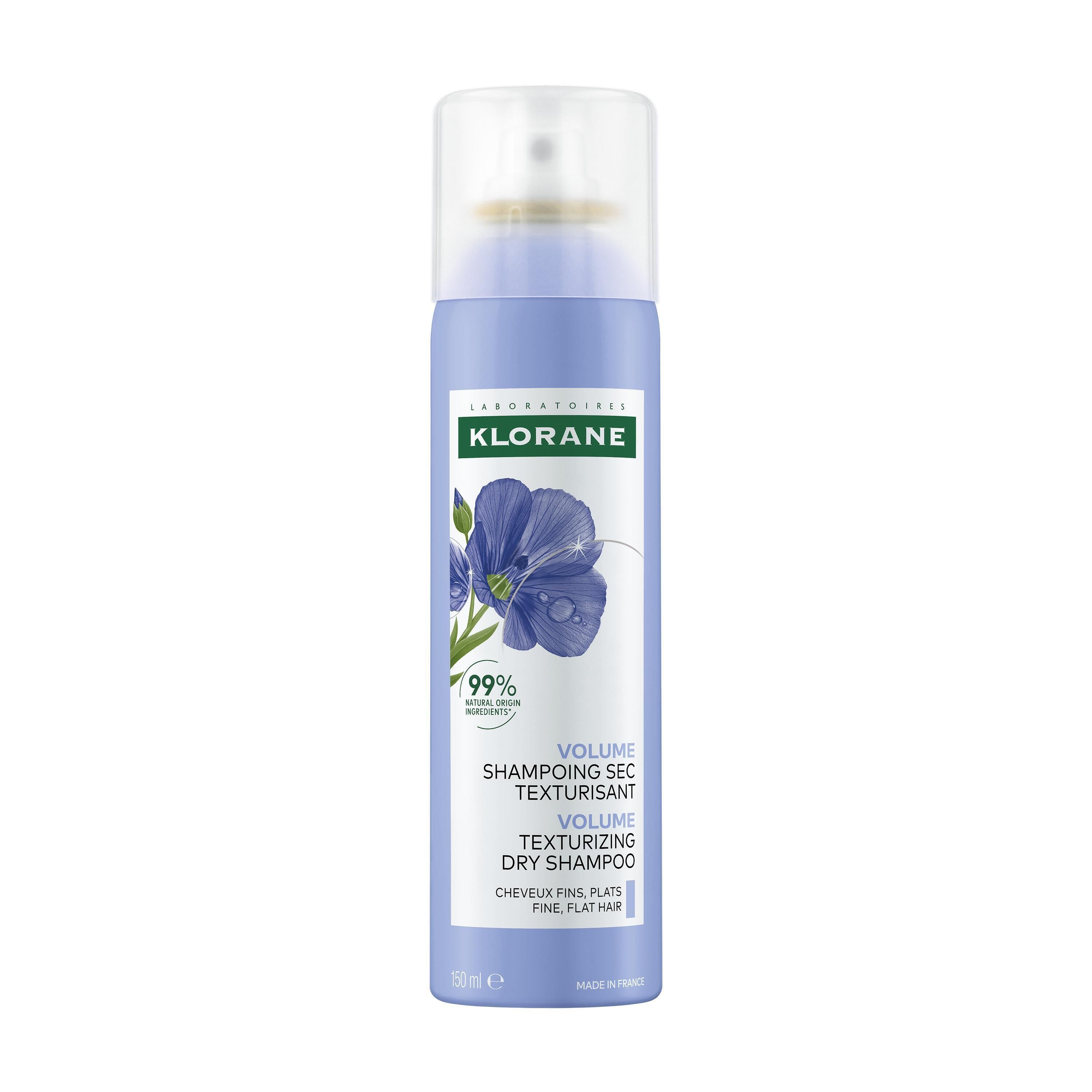 Flacon spray bleu et blanc avec logo KLORANE, illustration de fleur de lin et texte. Shampoing sec.