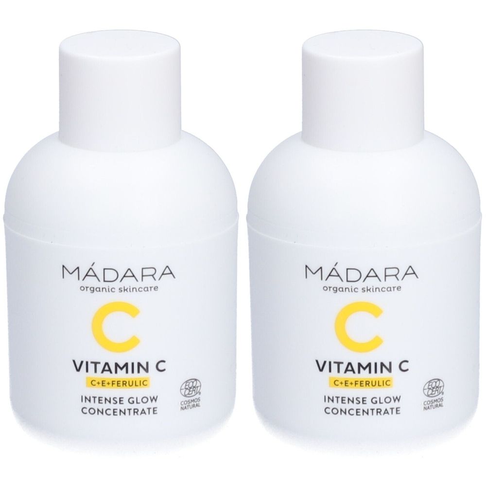 Deux flacons blancs avec impression jaune. Inscription : Mádara, Vitamin C, Intense Glow Concentrate. Avec label cosmétique.