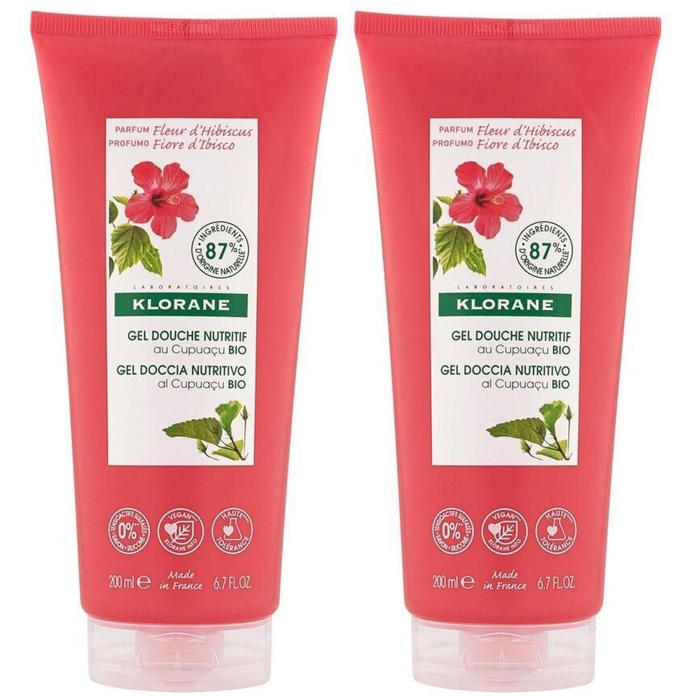 Deux tubes de gel douche. Emballage rouge avec étiquette blanche. Inscription : KLORANE, Gel Douche Nutritif, Fleur d'Hibiscus.
