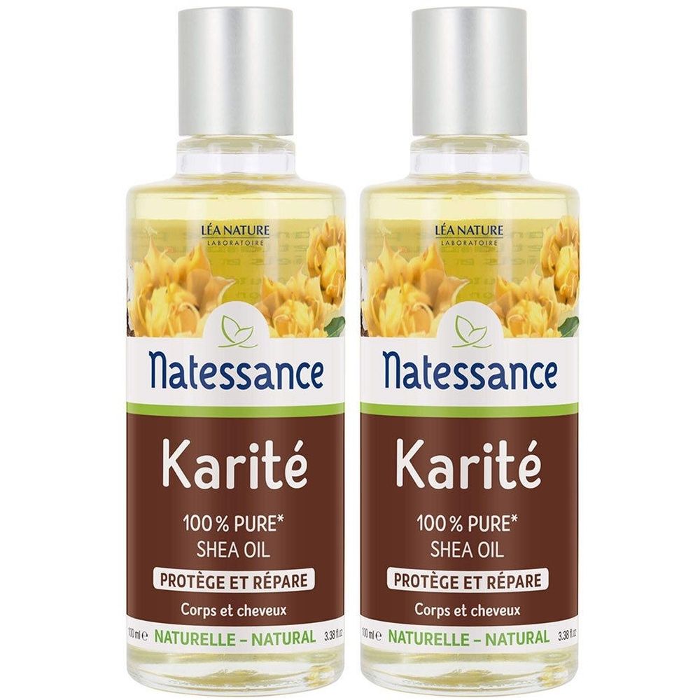 Zwei Flaschen mit silbernen Deckeln. Auf den Etiketten steht "Natessance Karité 100% Pure Shea Oil". Text: "Protège et Répare".
