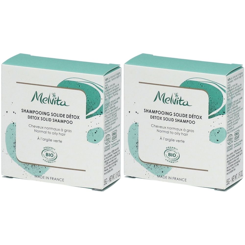 Zwei quadratische Kartons. Aufschrift: Melvita, Shampoing Solide Détox, für normales bis fettiges Haar. Bio-Zertifizierung. Hergestellt in Frankreich.