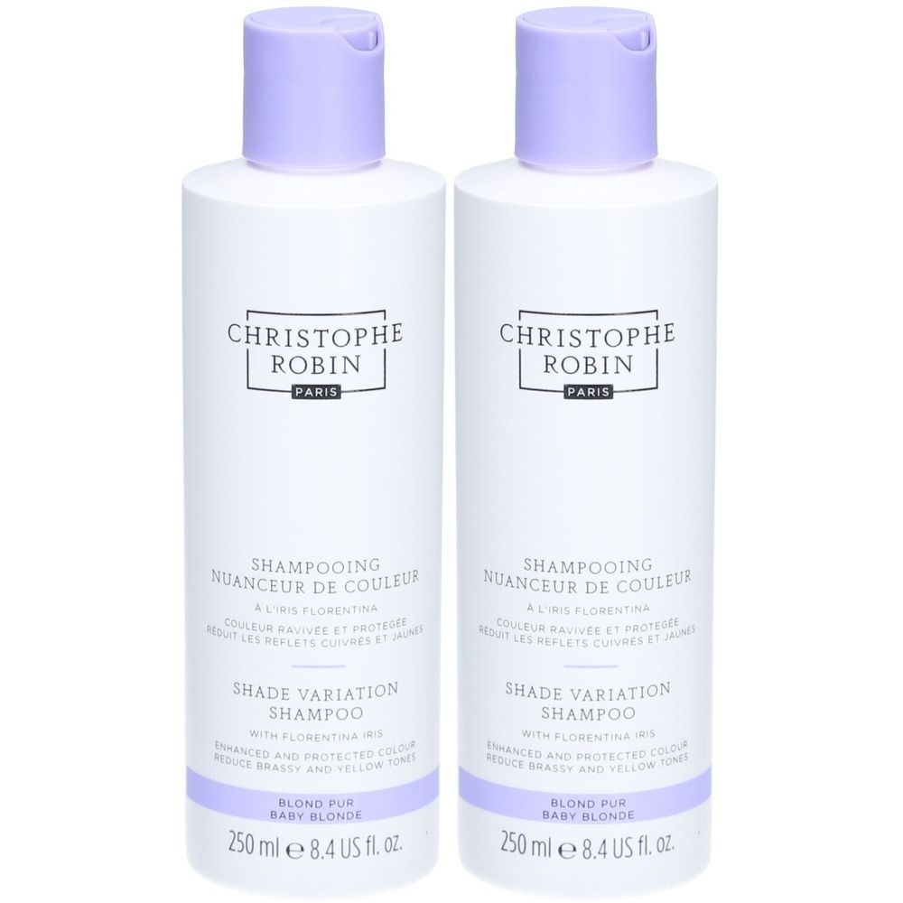 Deux flacons blancs avec bouchons violets. Inscription: CHRISTOPHE ROBIN, SHAMPOOING NUANCEUR DE COULEUR, SHADE VARIATION SHAMPOO. Texte: BLOND PUR BABY BLONDE.