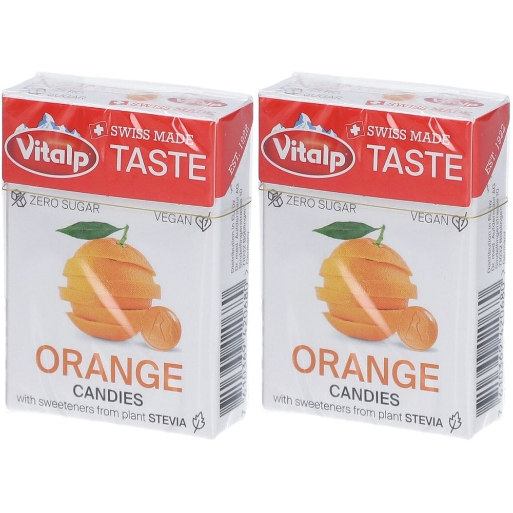Deux boîtes de bonbons Vitalp. Inscription : Orange, sans sucre, végétalien. Illustration d'une orange.
