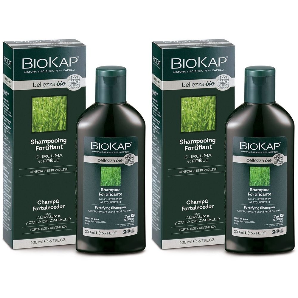 Deux flacons et deux boîtes de shampooing. Flacons noirs avec bouchon vert. Inscription : BIOKAP, Shampooing Fortifiant.